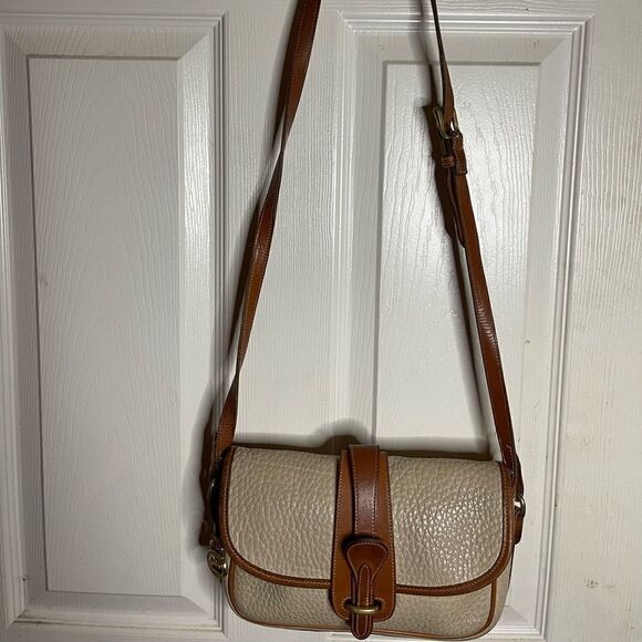 Dooney & Bourke vintage leather beige with tan trims and strap crossbody bag - Picture 1 of 15